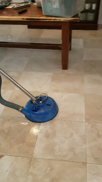 Tile and grout cleaning with a rotary extraction tool
