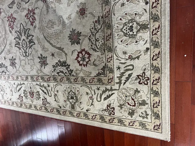 Oriental area rug cleaned on a hardwood floor