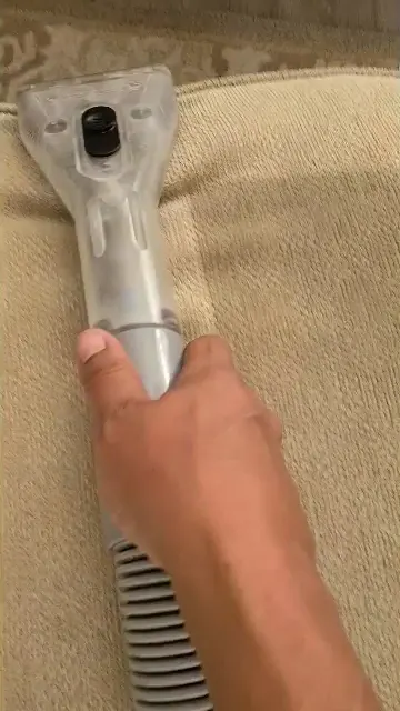 Upholstery tool on a sofa cushion