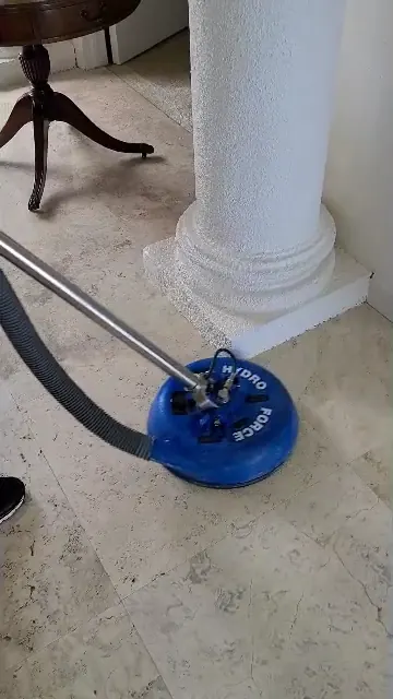 Rotary tile tool beside a column