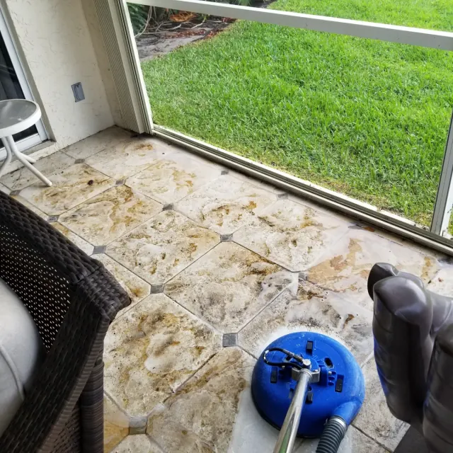 Travertine lanai pavers being cleaned